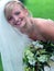 Smiling bride in white wedding dress