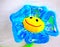 Smiling bright blue yellow toy flower