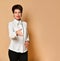 Smiling brunette woman with short haircut in stylish smart business clothing standing and giving hand to say hello