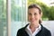 Smiling business woman with black jacket and white shirt