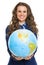 Smiling business woman giving earth globe