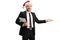 Smiling businessman with a christmas hat gesturing welcome with hand