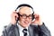 Smiling businessman wearing headphones looking to camera