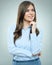 Smiling businesswoman blue shirt dressed standing on gray background.