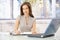 Smiling businesswoman at desk