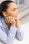 Smiling businesswoman dreaming in office