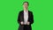 Smiling businesswoman explaining and gesturing while walking on a Green Screen, Chroma Key.