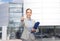 Smiling businesswoman with folder and keys