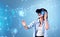 Smiling businesswoman in formal wear is wearing vr helmet