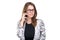 Smiling businesswoman in glasses talking on mobile phone. Beautiful young girl in Blazer on white isolated background