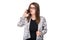 Smiling businesswoman in glasses talking on mobile phone. Beautiful young girl in Blazer on white isolated background