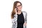 Smiling businesswoman in glasses talking on mobile phone. Beautiful young girl in Blazer on white isolated background