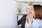 Smiling Businesswoman Standing By Flipchart