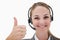 Smiling call center agent giving thumb up