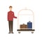 Smiling cartoon man bellman standing with luggage vector flat illustration. Joyful male baggage transportation worker