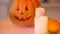Smiling carved Halloween pumpkin with scary face illuminated by burning candles