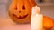 Smiling carved Halloween pumpkin with scary face illuminated by burning candles