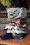 Smiling carved stone statue clothed in a colorful sarong and sash outside a temple in Bali Indonesia