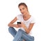 Smiling casual woman sitting with mobile phone