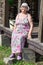 Smiling Caucasian senior grandwoman sitting on wooden porch