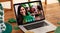 Smiling caucasian woman on laptop screen making st patrick\\\'s day video call at a bar