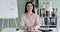 Smiling Caucasian Woman at Office Desk