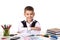 Smiling cheerful excellent pupil sitting still at the desk with white background