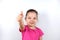 Smiling cheerful little preschooler caucasian girl shows hand gesture of agree or approval. Recommendation, advice, approval, good