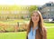 Smiling cheerful young woman in front of Neues Schloss New Palace of Stuttgart, Germany