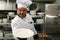 Smiling chef with empty plate