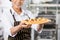 Smiling Chef Holding Tray With Stuffed Ravioli