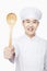 Smiling Chef holding wooden spoon, studio shot