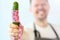 Smiling Chef Measuring Coiled Green Cucumber