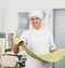 Smiling Chef Processing Spaghetti Pasta Sheet