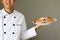 Smiling Chef proudly and happily presenting steamed crabs on the plate.