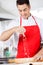 Smiling Chef Sprinkling Flour On Ravioli Pasta