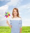 Smiling child with colorful windmill toy