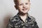 Smiling child. funny little boy. close-up. joy. 4 eyers old. military shirt