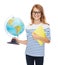 Smiling child with globe, notebook and eyeglasses