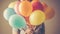 Smiling child holding bunch of colorful balloons, pure childhood enjoyment generated by AI