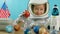 Smiling child holding a red planet Mars space rocket in his hands, close-up, pilot traveling into space.Child plays at