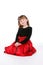 Smiling child in red and black holiday dress