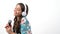 smiling child singer artist sings songs into microphone listen music in headphones, vocal