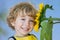 Smiling child with sunflower