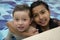 Smiling children in the swimming pool in sunny.