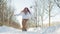 Smiling chubby redhead woman running in park in winter.