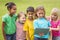 Smiling classmates looking at tablet