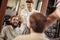 Smiling client sitting in barber shop