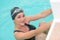 Smiling close up portrait woman professional swimmer