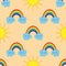 Smiling clouds with a rainbow and the sun. Children seamless pattren.